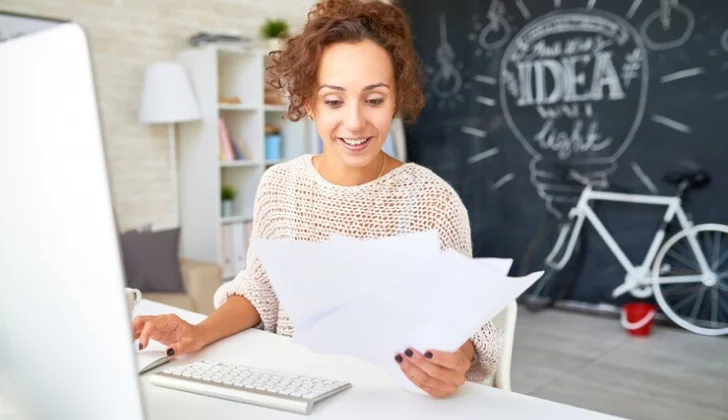 a woman checking a letter