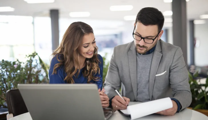two employees checking some documents
