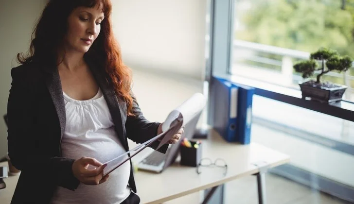 a pregnant woman at work