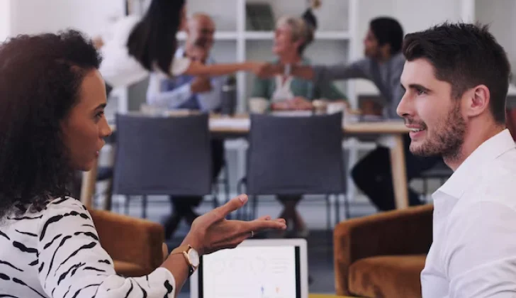 two employees having a conversation