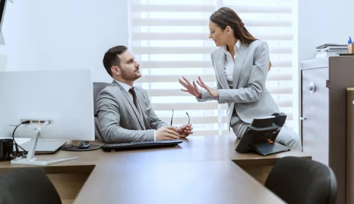 two employees having a conversation