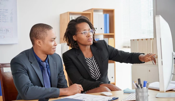 two employees discussing a project