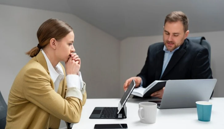 an employer and employee having a meeting
