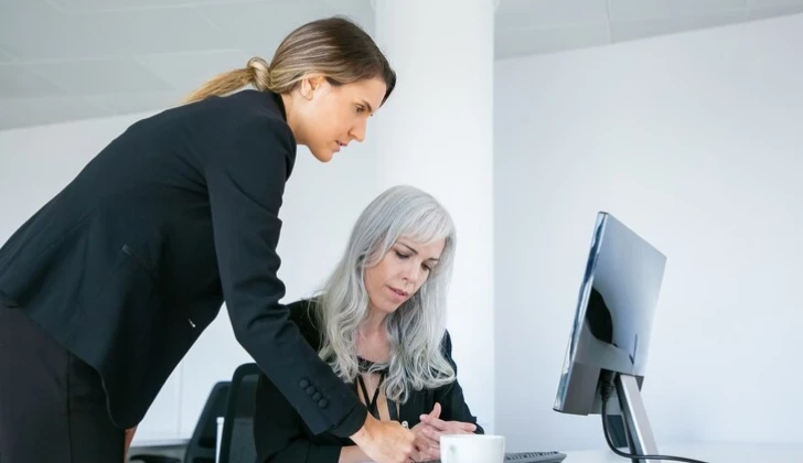 two employees working on a task