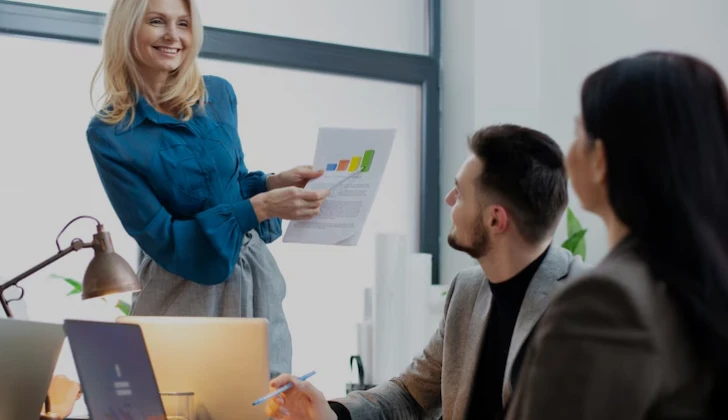 team members having a meeting about analytics