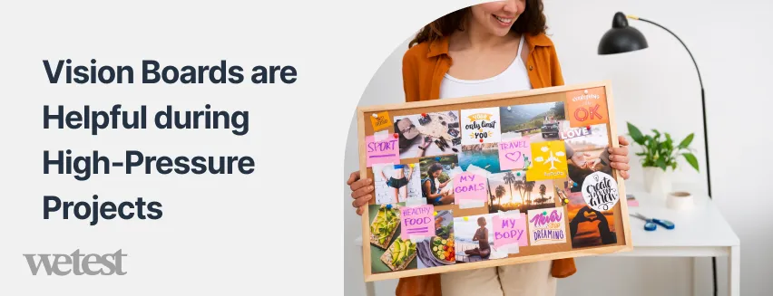 a girl holding a vision board standing in front of a desk