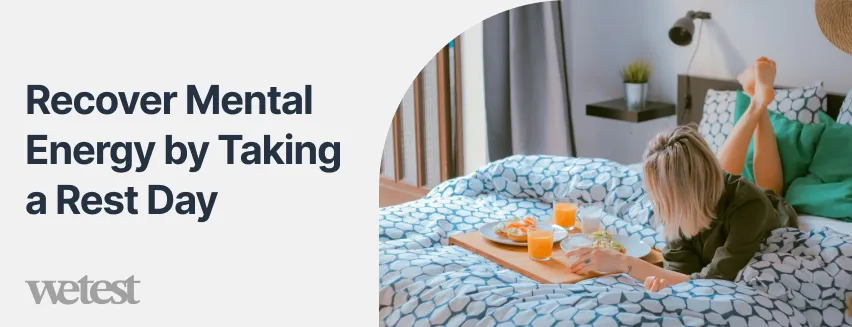 A woman eating breakfast on a bed