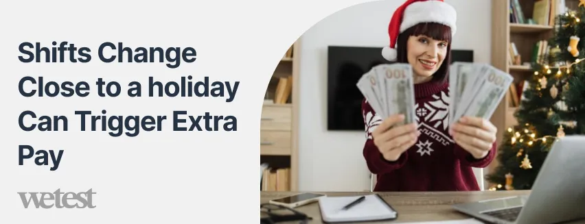 A woman wearing a Santa Clause hat sitting at a desk holding money