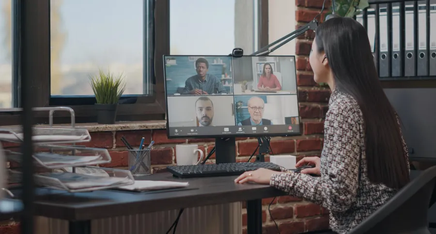 a woman having a virtual meeting with a remote team